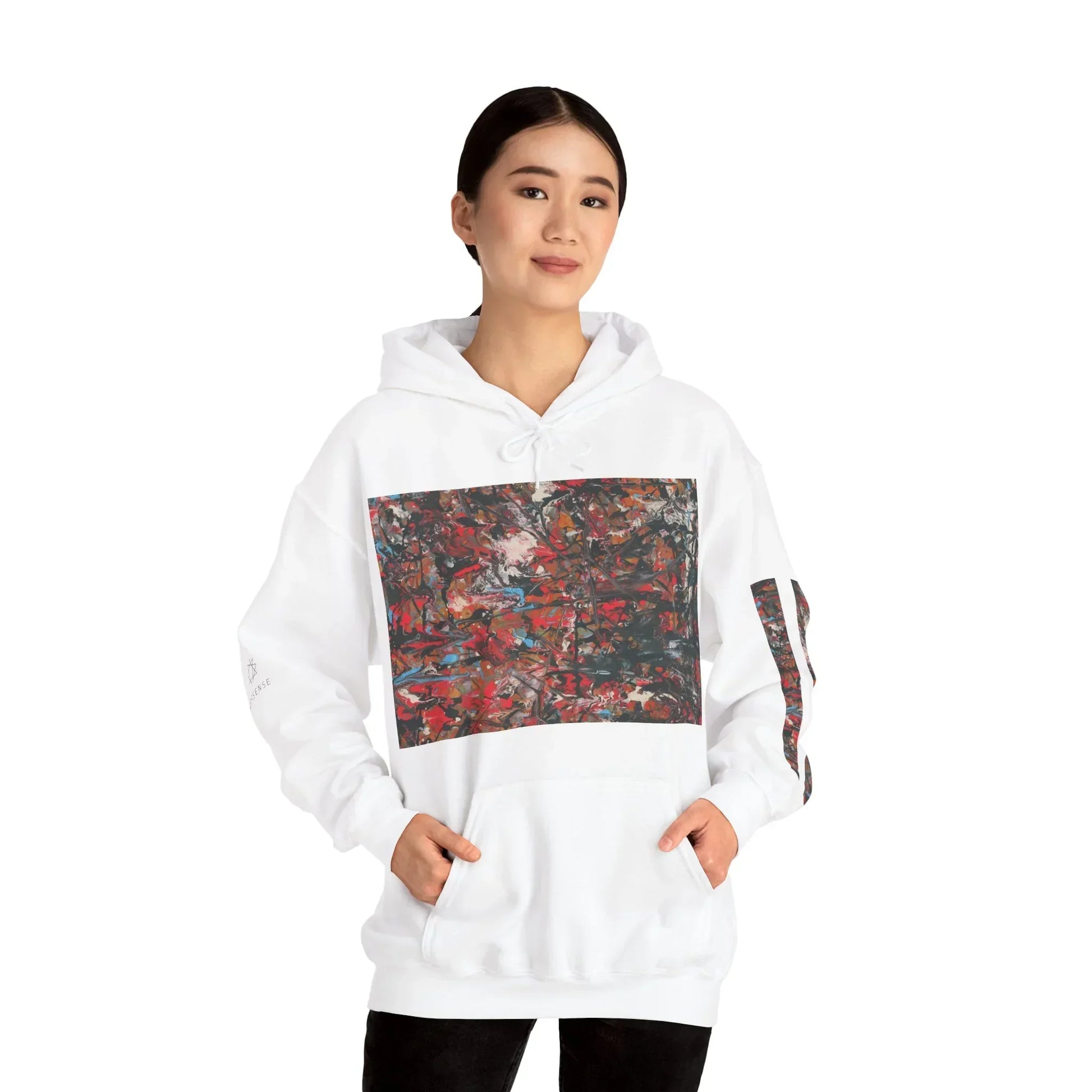 Woman wearing white hoodie with colorful abstract art print on front and sleeve, studio background