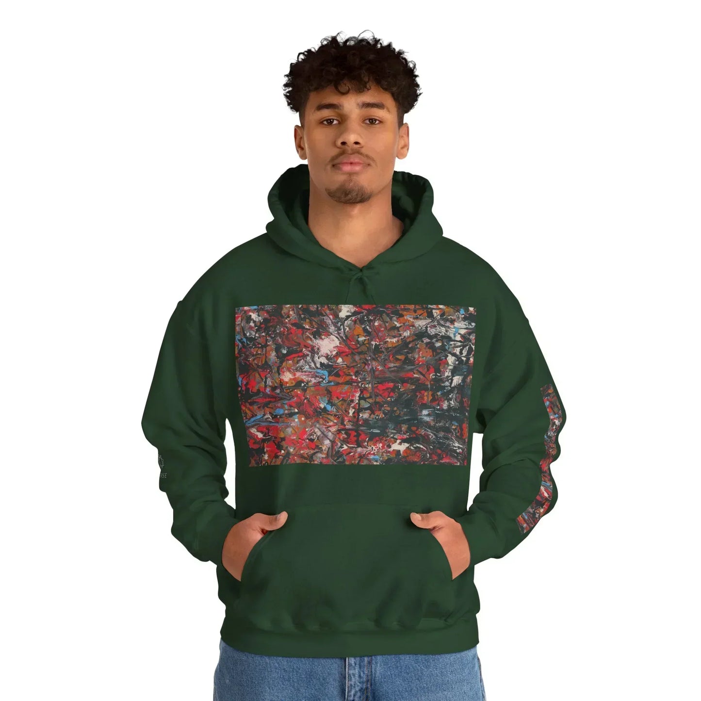 Man wearing dark green hoodie with colorful abstract art print on front and sleeve